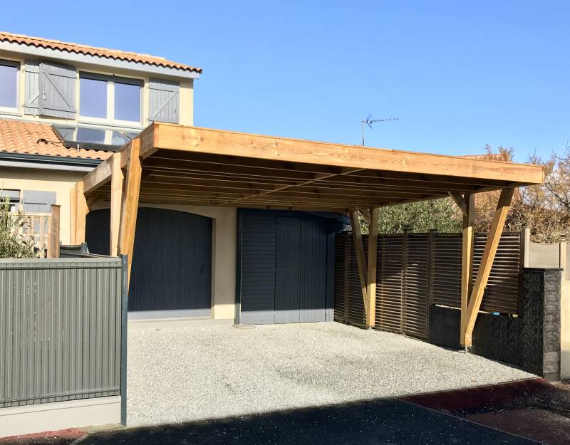 Construction d'un carport double en bois pour un particulier à bruges